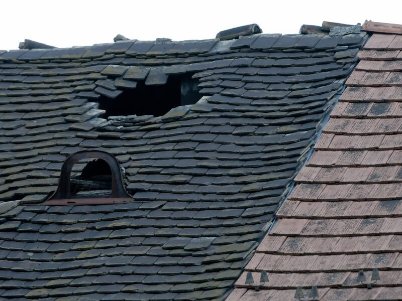 Damaged roof in need of repair by emergency roofers in Middletown, NJ.